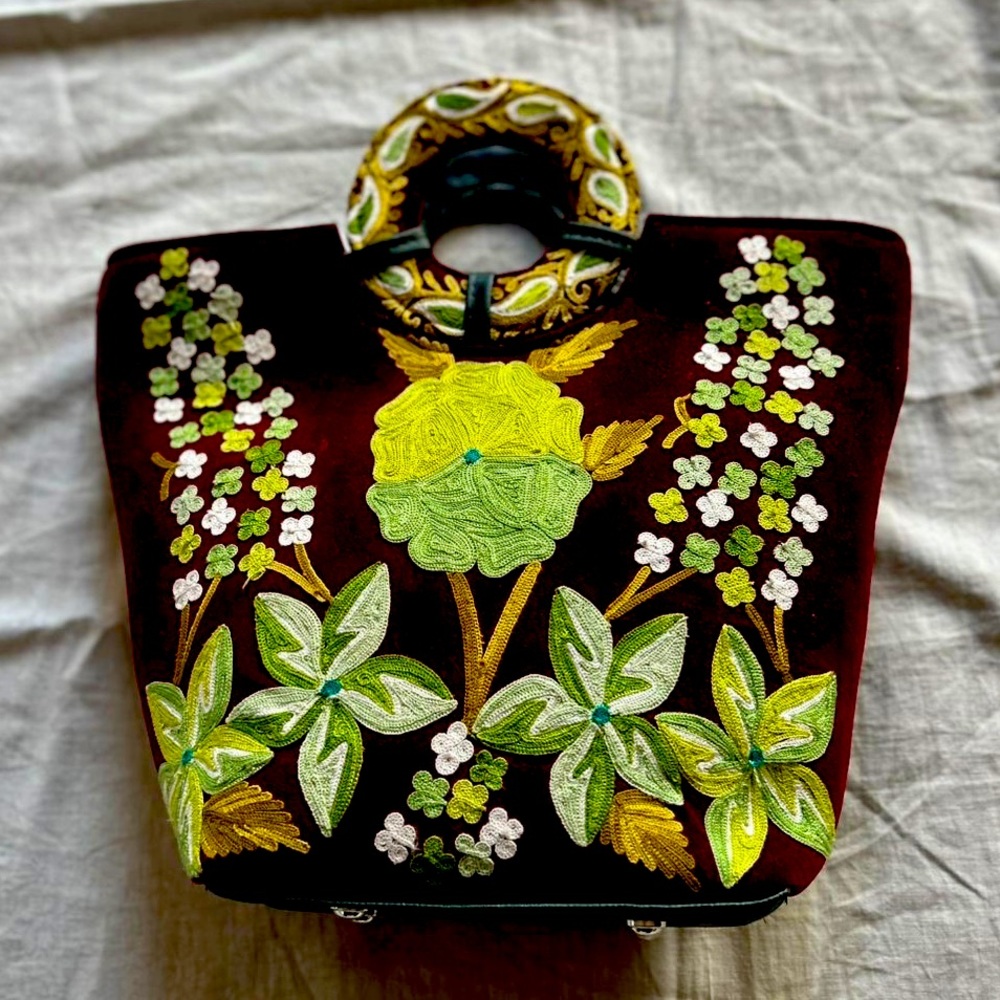 It’s a velvet purse with hand work called chain stitch and aari embroidery.